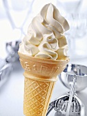 Cone of soft vanilla ice cream