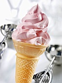Cone of soft strawberry ice cream