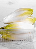 Chicory in a plastic container