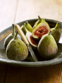 Fresh figs on a plate with knife