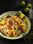 Asian egg noodles with pork and star fruit