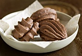 Piped chocolate biscuits with chocolate filling