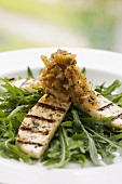 Grilled chicken fillets on rocket with onion chutney