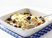 Fish gratin with spinach and olives