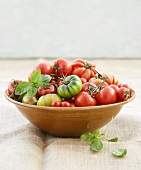 Tomatoes in a bowl with basil