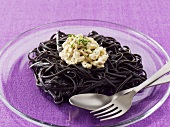 Black pasta with chicken in mayonnaise