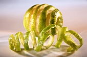 A lime peeled in a spiral shape