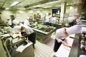 Chefs at work in a commercial kitchen