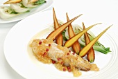 Tilapia fillet with citrus fruit sauce and vegetables