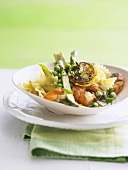 Farfalle with green asparagus, peas and prawns