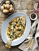 Fried plaice with garlic and potatoes