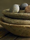 Pebbles in stacked stone dishes