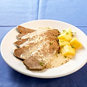 Beef with horseradish sauce and boiled potatoes