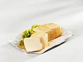 A Romadur cheese, partly sliced
