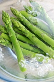Green asparagus in iced water