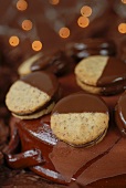 Chocolate-dipped filled biscuits