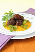 Meatballs on mango sauce