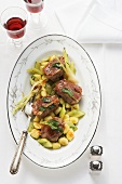 Pork saltimbocca with gnocchi and gherkins