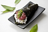 A sushi roll filled with tuna and 'negi' (Japanese spring onions)