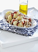 Potato and bean salad with pancetta, dried tomatoes and feta