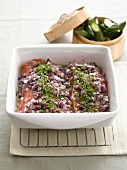 Baked salmon with red onions and parsley