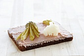 Pumpernickel with pate and gherkins