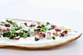 Tarte flambée with bacon and spring onions