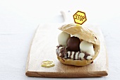 A bread roll filled with chocolate marshmallows and topped with a stop sign