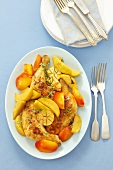 Oven baked chicken legs with apples, nectarines and garlic