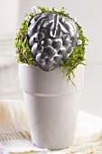 Christmas decoration with moss and mini baking tins