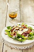 Spinach salad with fried mushrooms, Parmesan cheese and hazelnuts