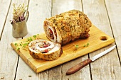 Pork roulade stuffed with mushrooms and dried cranberries