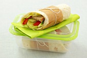 Tortilla wrap with minced meat, salad, pepper and cucumber