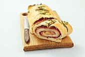 A yeast pastry spiral filled with mozzarella, mortadella and salami
