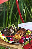 Grilled spare ribs with a mixed leaf salad