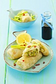 Rice paper rolls stuffed with fish and leek