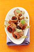 Fried plums wrapped in bacon