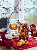 Gingerbread and vanilla biscuits in jars