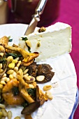 Wild mushrooms with pine nuts and Camembert