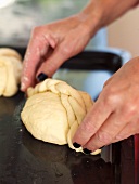 A mini plaited roll being made