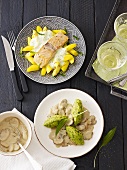 Salmon with a chive sauce and polenta and chive gnocchi with a creamy mushroom sauce