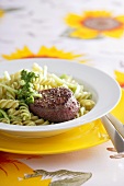Beef medallion with fusilli and pesto