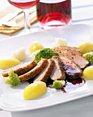 Roasted duck breast with potatoes and steamed vegetables