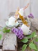 Lilac sorbet with caramel on wooden boards out of doors