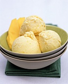 Several scoops of mango ice cream