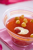 Raspberry jelly with hazelnuts in a small glass bowl