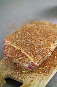 Joint of beef, brushed with mustard and seasoned