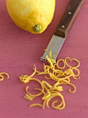 Lemon with zest and zester