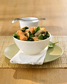 Salmon, mushrooms and spinach in a bowl