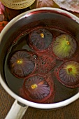 Poaching figs in red wine and blackberry sauce